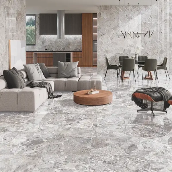 Pared de salón en porcelánico con color neutro y sensación de continuidad