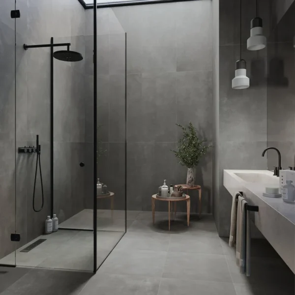 zona de ducha ambientada con   porcelanico gris oscuro en disposición recta